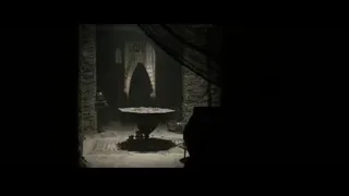 two robed figures in dimly lit abandoned room — Gladiator 2