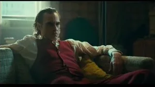 man with blonde hair sitting on couch — Joker