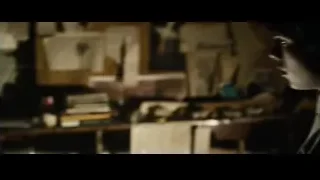 Man in beige jacket in dim room — Superman: Man of Steel
