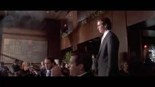 young man in suit on wooden staircase — American Psycho