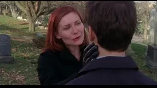 red-haired woman comforting man in cemetery — Spider Man