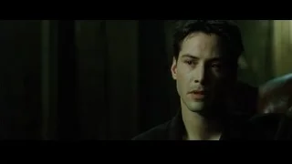 man's face close-up in dim room — The Matrix