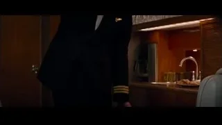 Man in suit holding gun in dimly lit room — The Amazing Spider Man 2
