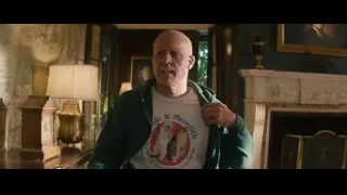 elderly man in green hoodie in living room — Deadpool 2