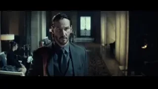 Man in suit in hotel lobby — John Wick