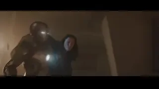 Man and woman embracing in armor — Iron Man 3
