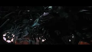 man sitting on red spaceship-like object — The Matrix