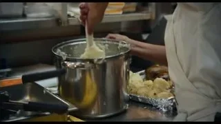 woman in kitchen with eyes closed — The Bear