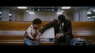 father and son sitting in subway station — The Persuit of Happyness