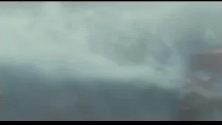 large wave crashing onto wooden surface — Life of Pi