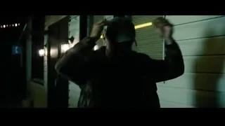 man in cap and jacket in dimly lit room — Superman: Man of Steel