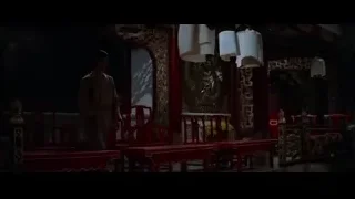 man in robe in dimly lit temple — Bruce Lee: Enter The Dragon