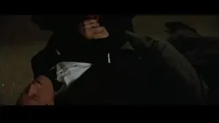 man lying on ground in dark room — Batman