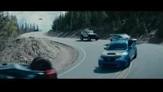 cars driving on winding mountain road — Furious Seven