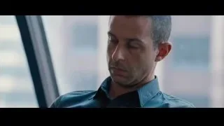 two men in suits in room with windows — The Big Short
