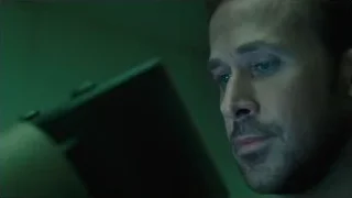 man's serious face in dim light — Blade Runner 2049