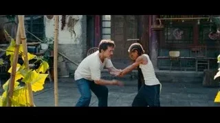 man and young girl dancing in outdoor courtyard — The Karate Kid