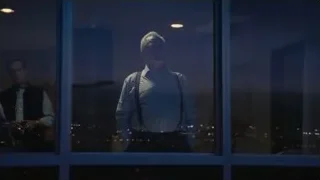 Elderly man looking at city night view — Succession