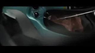 man's face through racing helmet on track — F1