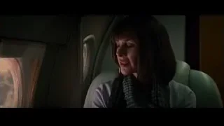 Woman in airplane looking at ultrasound scan — The Amazing Spider Man 2