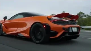 orange sports car driving on highway — Sports Cars