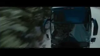 bus driving on winding mountain road — Furious Seven