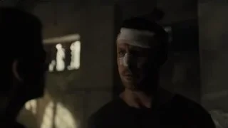 man with bandaged head standing in dim room — Blade Runner 2049
