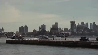 city skyline with helicopters on pier — Succession