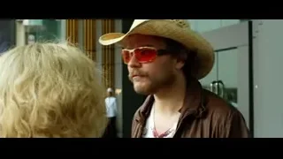 Man in cowboy hat speaking to woman — Lucy