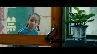 young girl looking out window — The Karate Kid