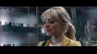 woman in yellow blazer smiling with city background — The Amazing Spider Man 2
