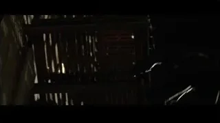 person walking up stairs in dark room — Batman