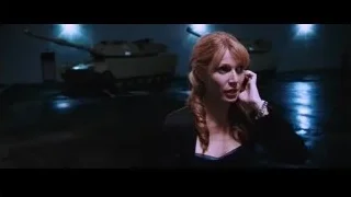 woman with red hair near tank in dark room — Iron Man