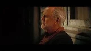 Elderly man close-up in dimly lit room — Interstellar