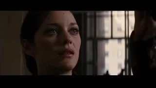woman's face in room with city view — Batman: The Dark Knight Rises
