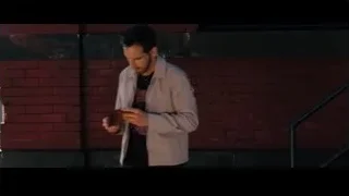 man looking at phone by brick wall — The Secret Life of Walter Mitty
