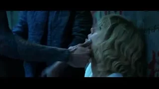 woman getting hair cut in dark room — Lucy