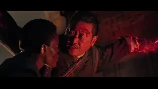 man pointing at bloody man in dark room — Doctor Strange 2