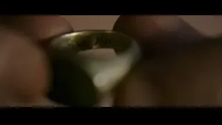 hand holding gold engraved ring — Gladiator 2