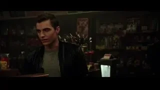 Young man sitting at desk with books — Now You See Me 2