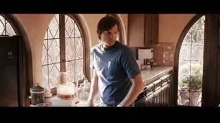 Young man talking on phone in kitchen — Jobs