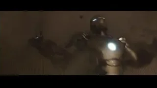 man standing in dark room — Iron Man 3