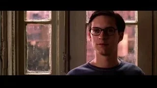 young man looking at camera by window — Spider Man 2