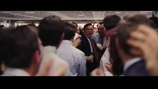 men shouting in crowded office — The Wolf Of Wall Street