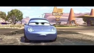blue sports car parked at desert motel — Cars