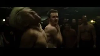 Two men fighting in dimly lit room — Fight Club