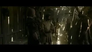 Men standing in medieval wooden cabin — Gladiator 2