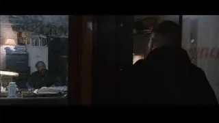 man by OFFICE window looking at desk — Southpaw