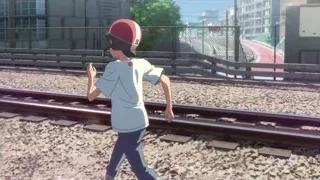 boy in red helmet on railway track — Weathering with You