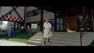 woman dressed as clown walking by ambulance — Batman: The Dark Knight